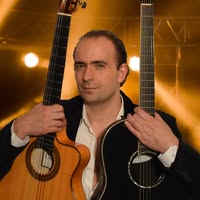David Vasco with two guitars.